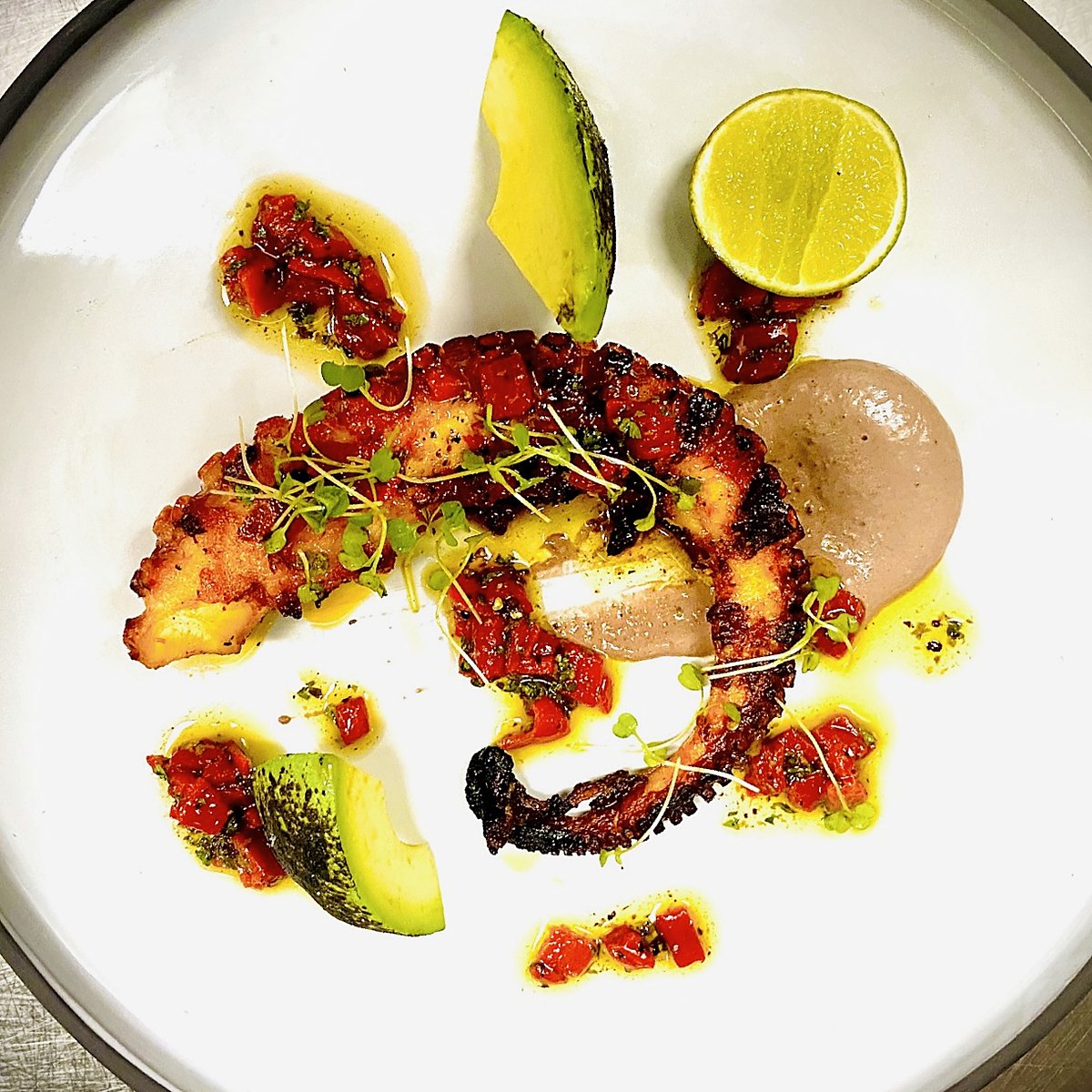 Charred octopus with avocado and lime